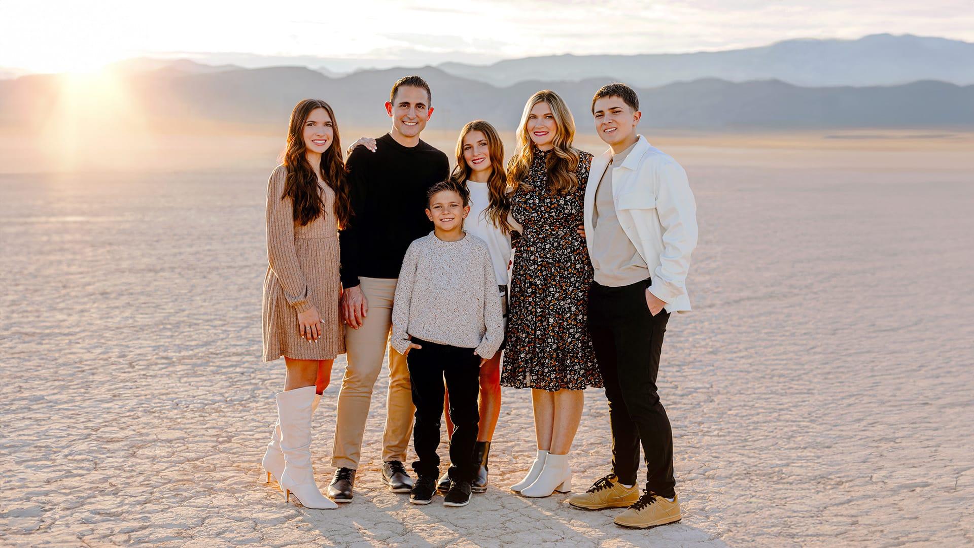 The Dr. Jeremy Manuele Family 2024 in a desert lake bed backdrop portrait